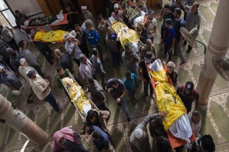 Body of Rasmi Abu Malhous and seven members of his family who were killed in overnight Israeli missile strikes.