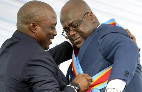 Former Congolese President, Joseph Kabila presented the Presidential sash to new Congolese President, Felix Tshisekedi on Thursday.