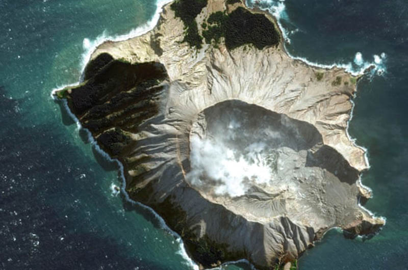 A satellite image shows White Island before volcanic eruption on Monday.