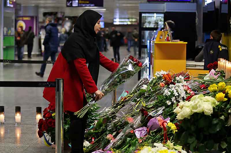 People pay tribute to the plane crash victims in Iran