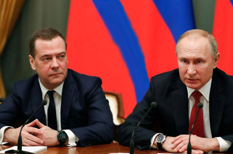 Former Russia’s Prime Minister Dimitry Medvedev with President Vladimir Putin