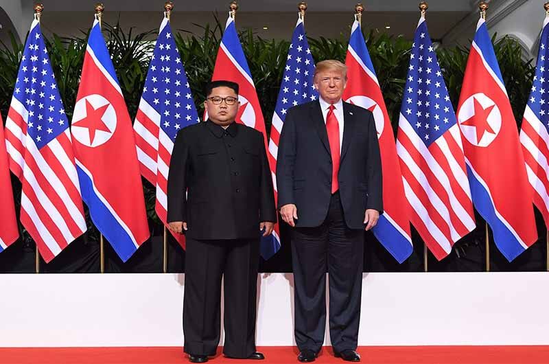 US President Donald Trump with the North Korean President Kim Jong Un